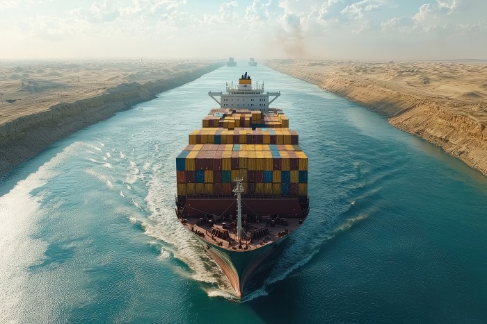 Massive Cargo Ship Sailing Through Suez Canal